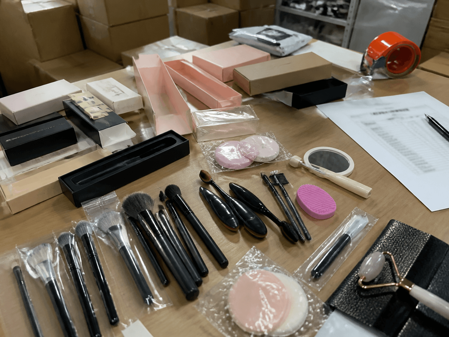 Beauty tool samples and packaging reviewed on a desk