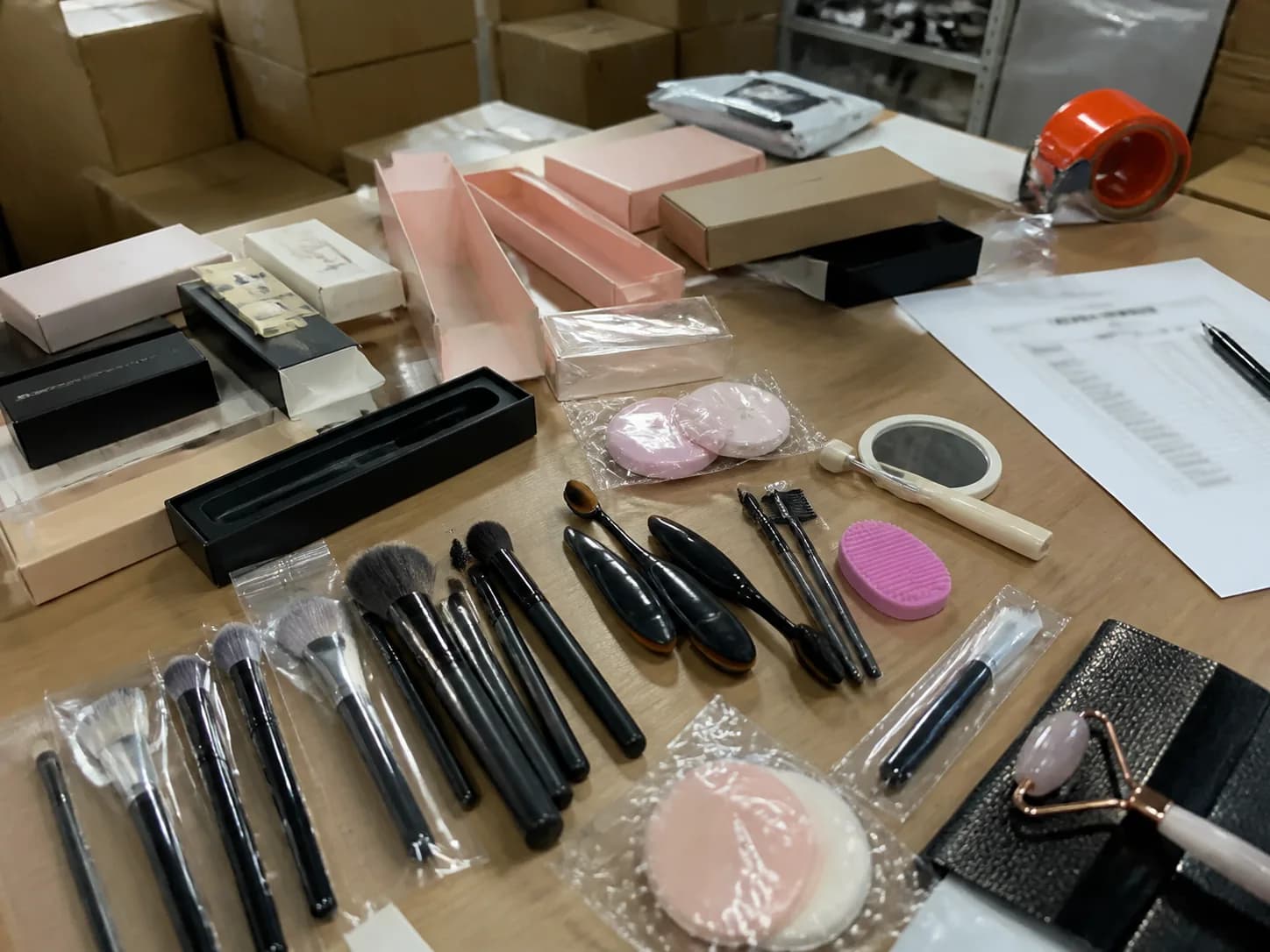 Beauty tool samples and packaging reviewed on a desk