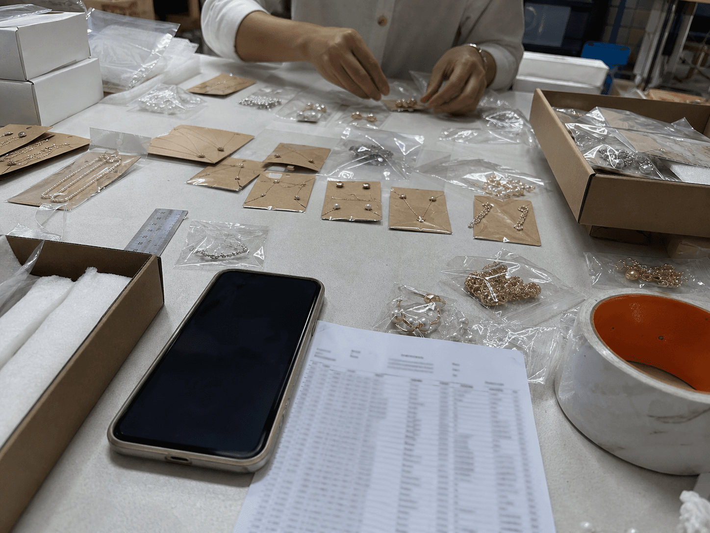 Jewelry samples laid out for packaging review