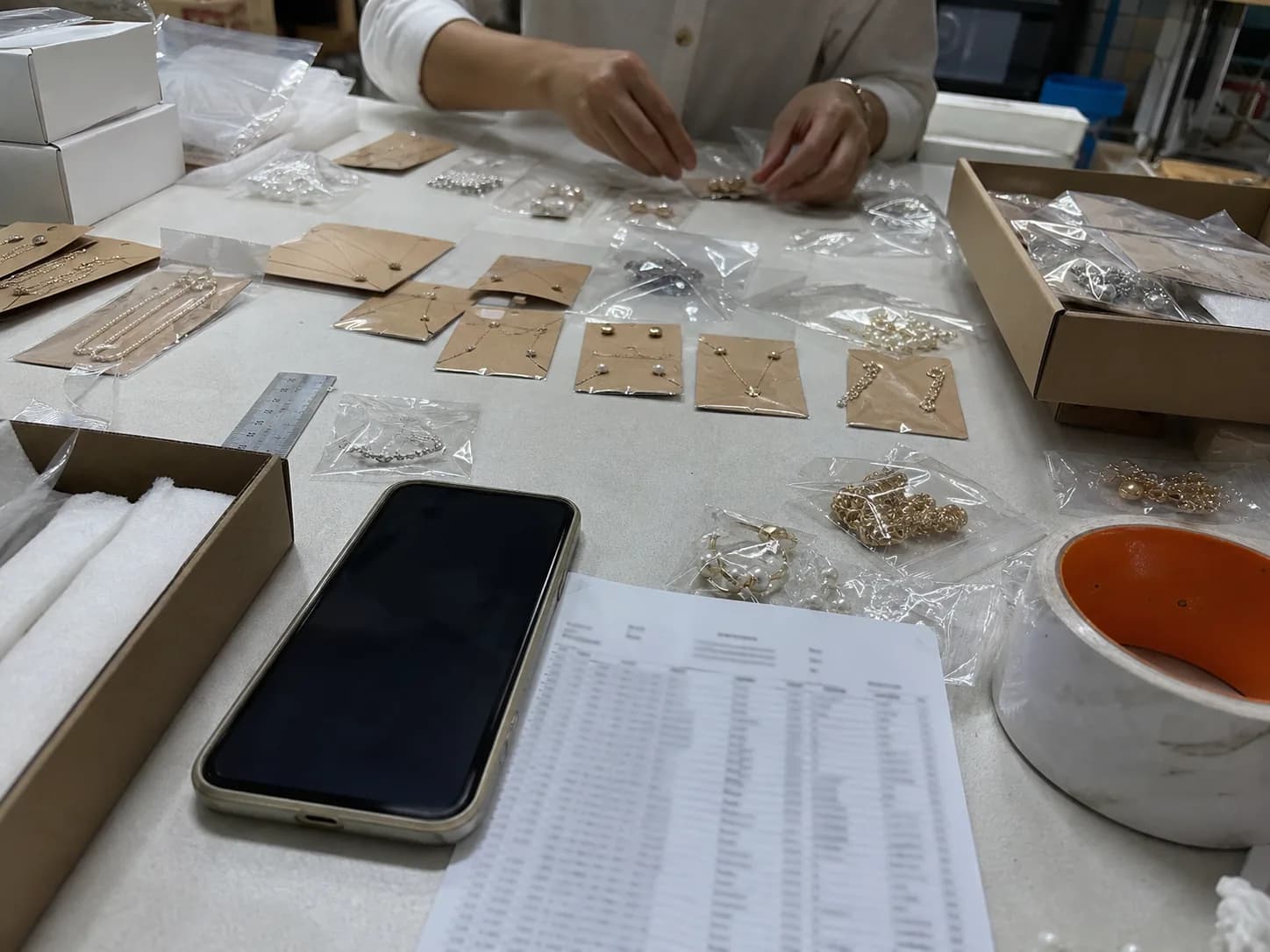 Jewelry samples laid out for packaging review